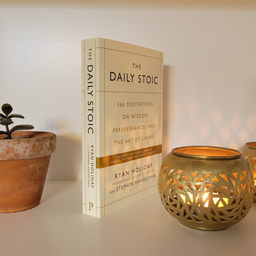 The front cover and spine of The Daily Stoic: 366 Meditations on Wisdom, Perseverance, and the Art of Living by Ryan Holiday and Stephen Hanselman