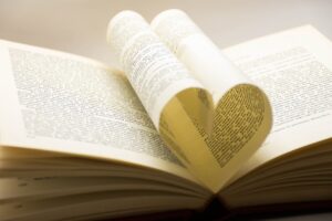 Romance novel sales -- book pages folded in the shape of a heart